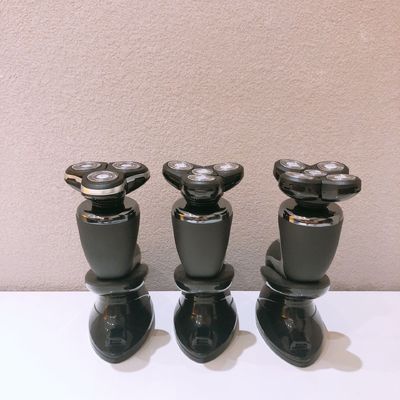 Yüz kullanımı için paslanmaz çelik bıçağı ve plastik kolu olan taşınabilir erkek elektrikli traş makinesi